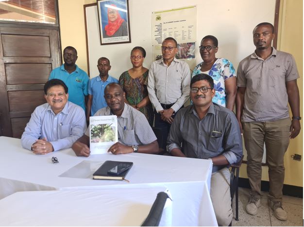 Two scientists, Mr. Saibal K. De (seated left) and Mr. John Magesh (seated right) from Deejay Group in India when they visited TARI Mikocheni for collaboration mission on Hybrid Coconut Research. 