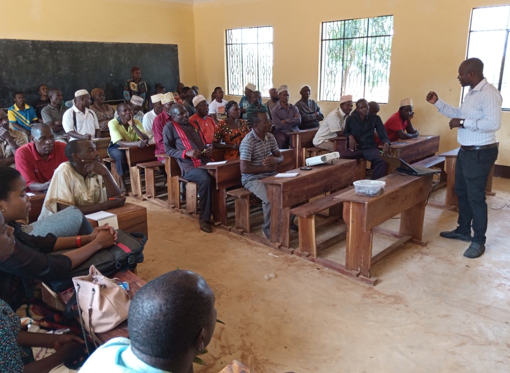 The Coordinator of Research and Innovation Mr. Masoud Salehe, giving an introductory presentation on the state of Oil Palm in Tanzania to farmers from various villages in Simbo Ward at ongoing training in Kigoma District Council