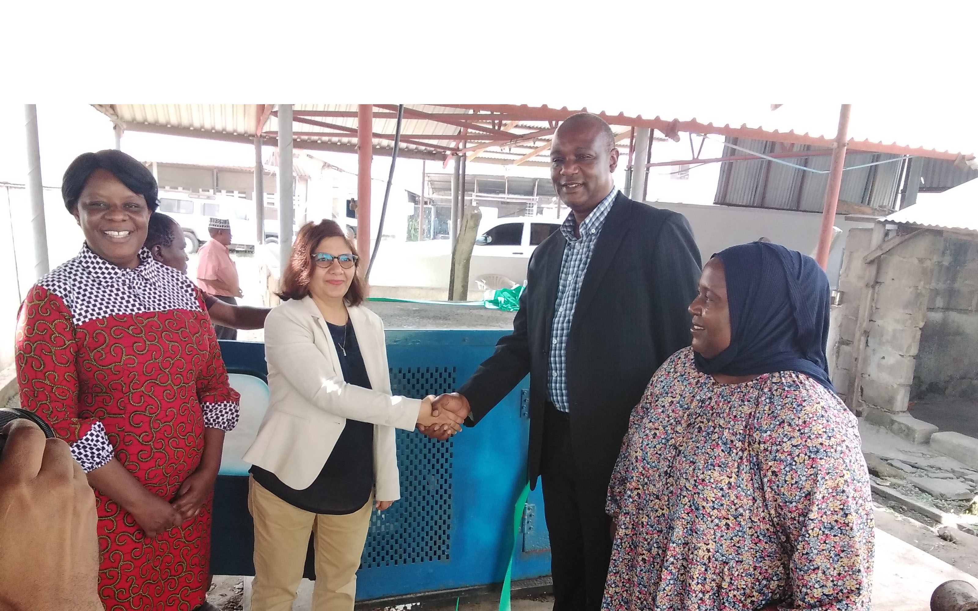 Dr. Leena Tripathi (Second left), IITA Director - East African Hub hands over one generator to Dr. Fred Tairo (Second right), Center Manager - TARI Mikocheni.