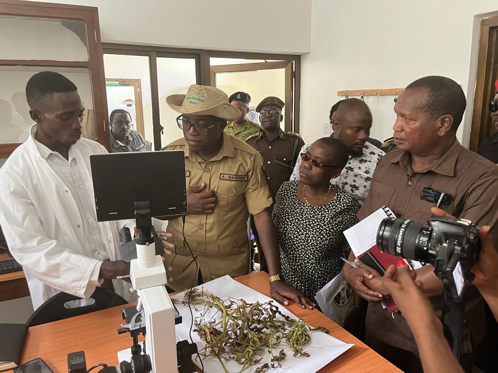 Hon. Antony Peter Mavunde (MP) Deputy Minister of Agriculture receiving an overview on nematodes count and identification technology and analysis on his visit day at TARI Tengeru