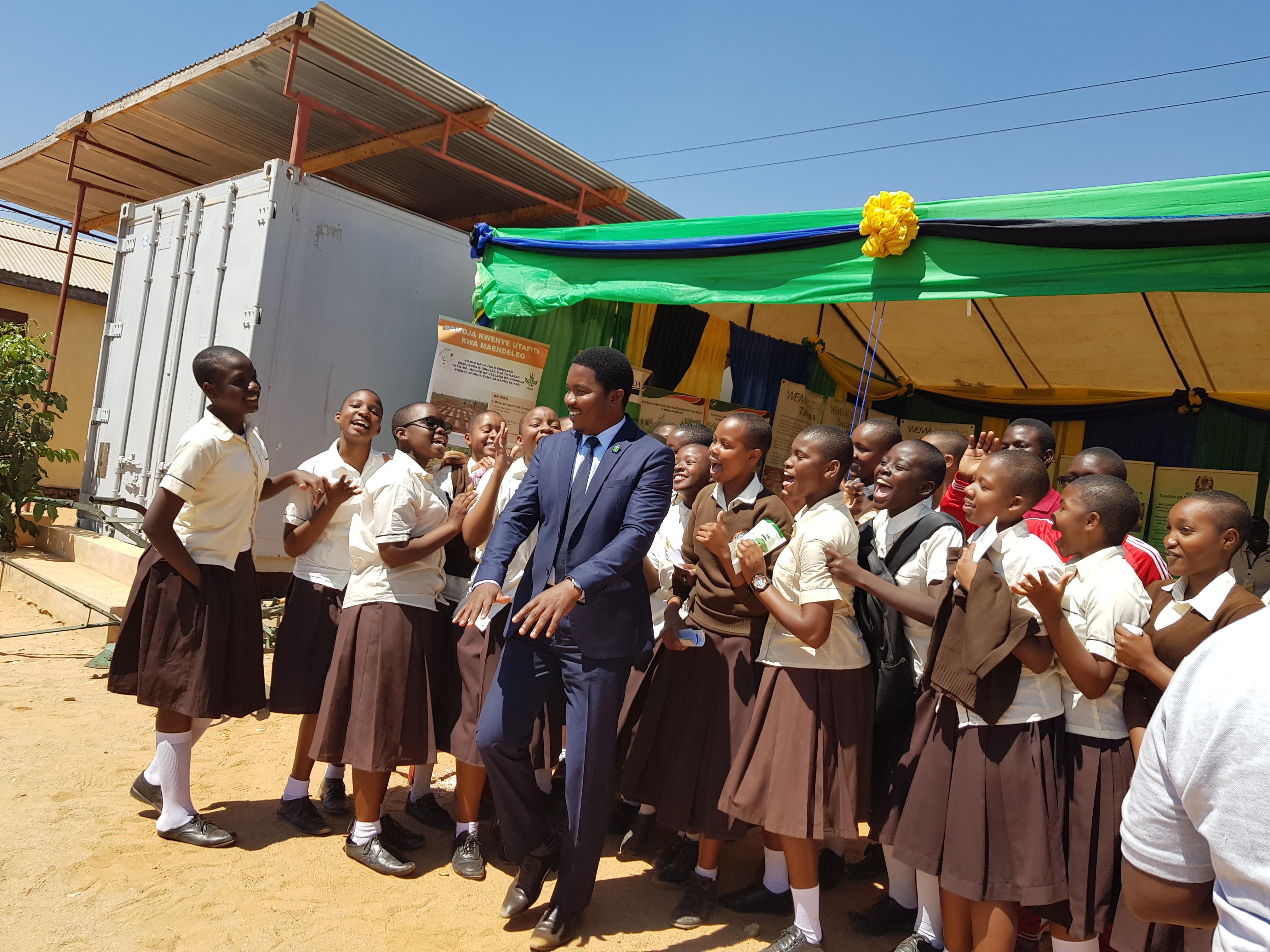 The Minister of State President's Office Regional Administration and Local Government Hon Suleiman S Jaffo pose a memory picture with Dodoma secondary school students (future scientists) who visited TARI-Makutupora pavilion during Nanenane festivals for l