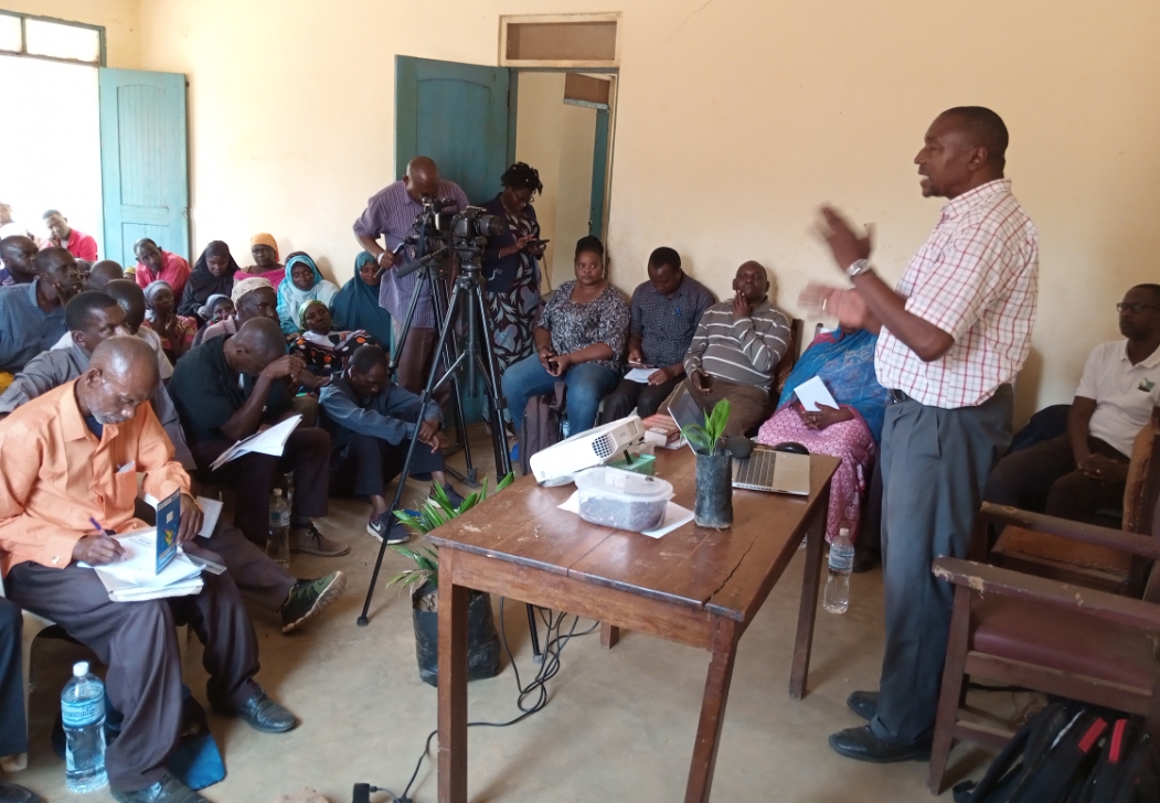 Representative of the Director of Kigoma Rural Council Mr. Deogratius Luvakule opening a training on the best cultivation of Oil Palm to farmers in Kigoma Rural District Council.